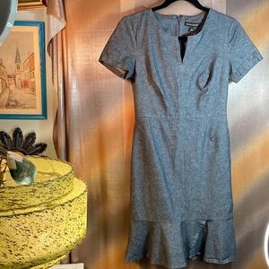 Dark gray fitted dress with flare around hem. Top stitched. Size 4. 32” chest B6